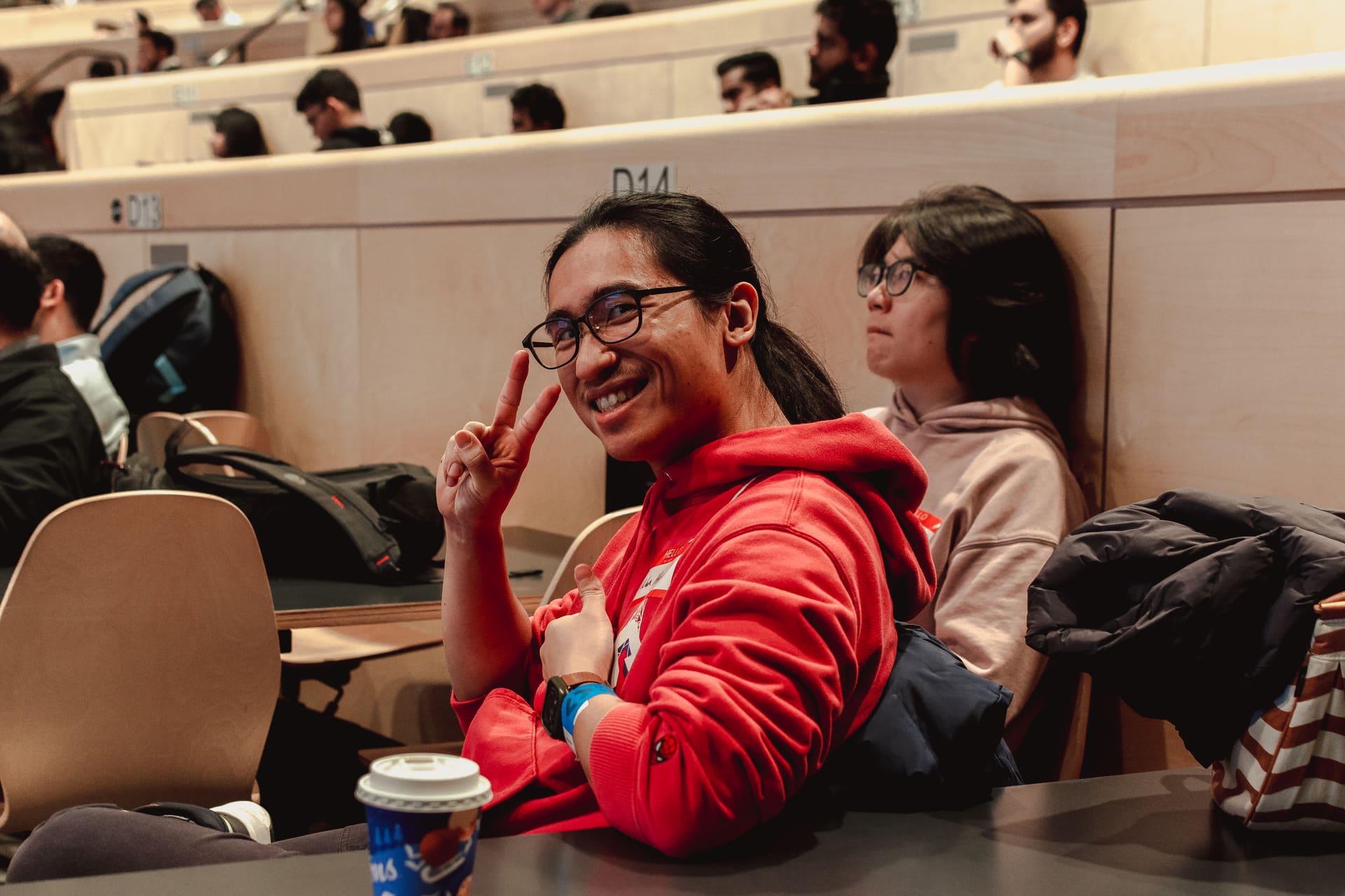 An attendee smiling at a GDG Toronto event
