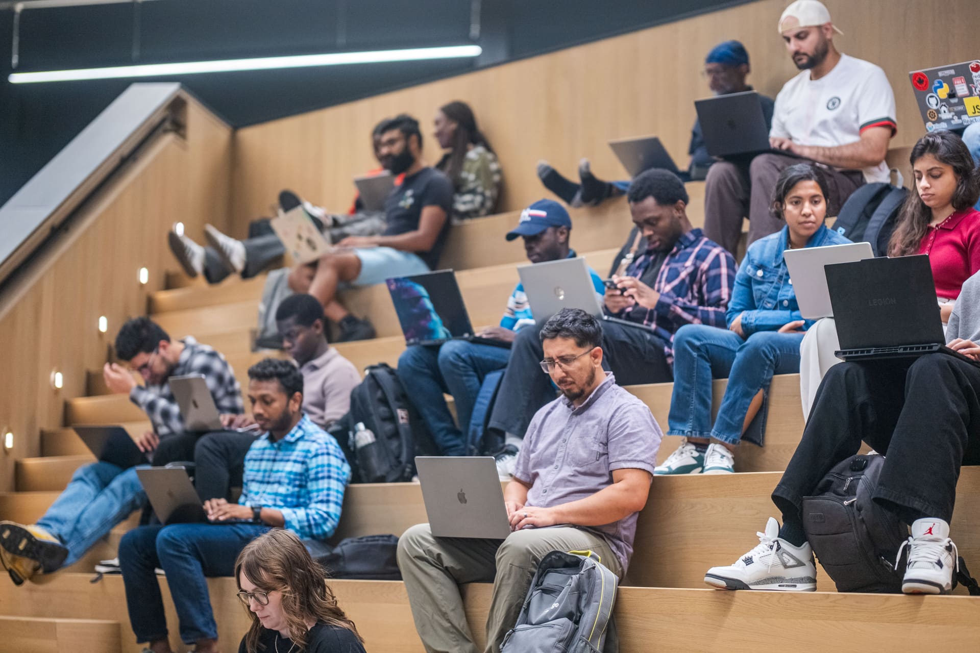 Attendees coding on laptops at a GDG Toronto hackathon